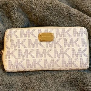 Large authentic Michael Kors signature print leather wallet.